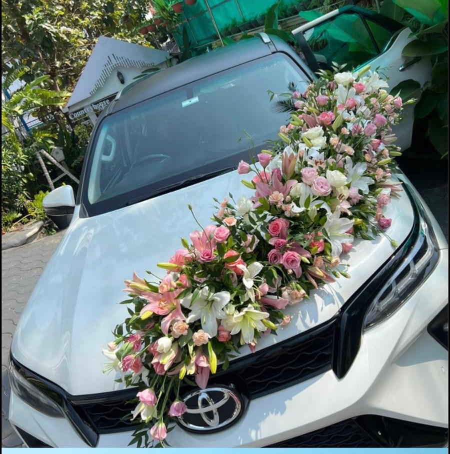 Full pink and white lily bonnet on a white Toyota, fitted at Countryhouse