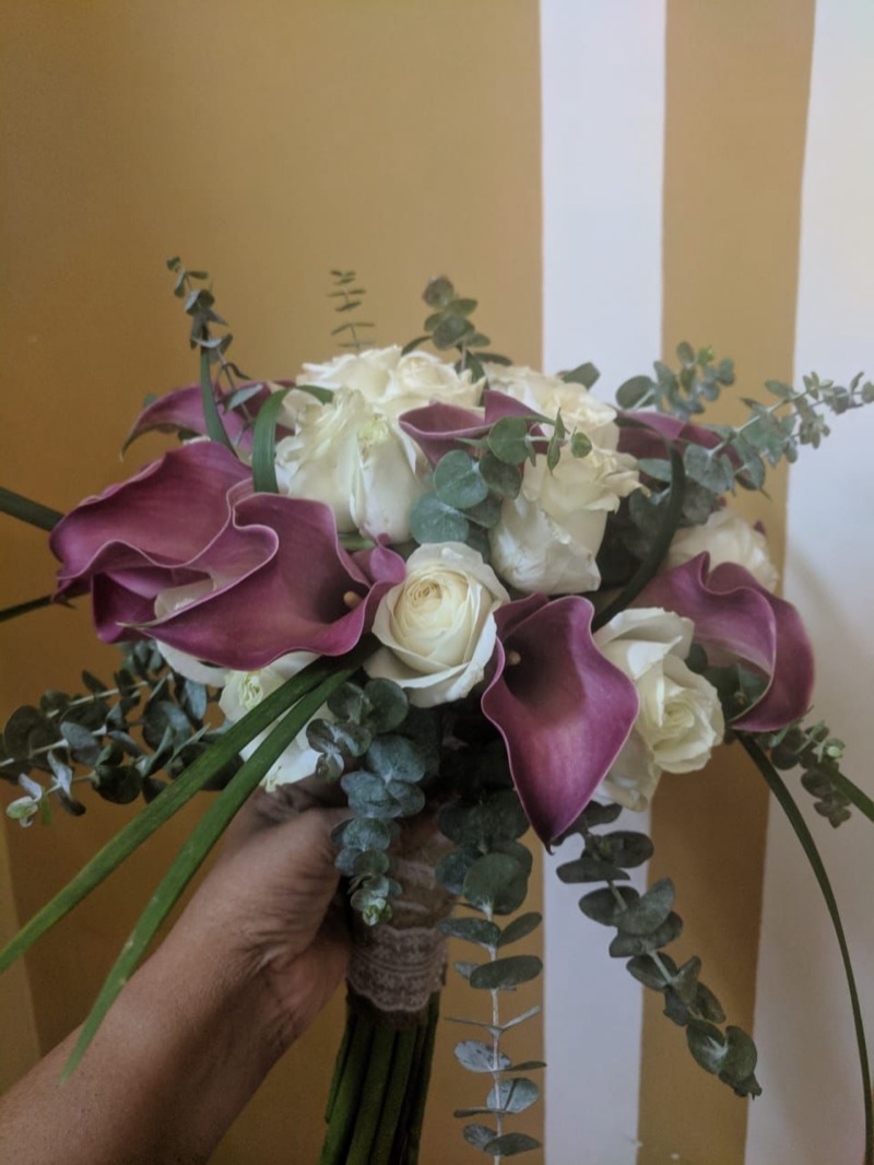 Purple calla lily and white rose bridal bouquet