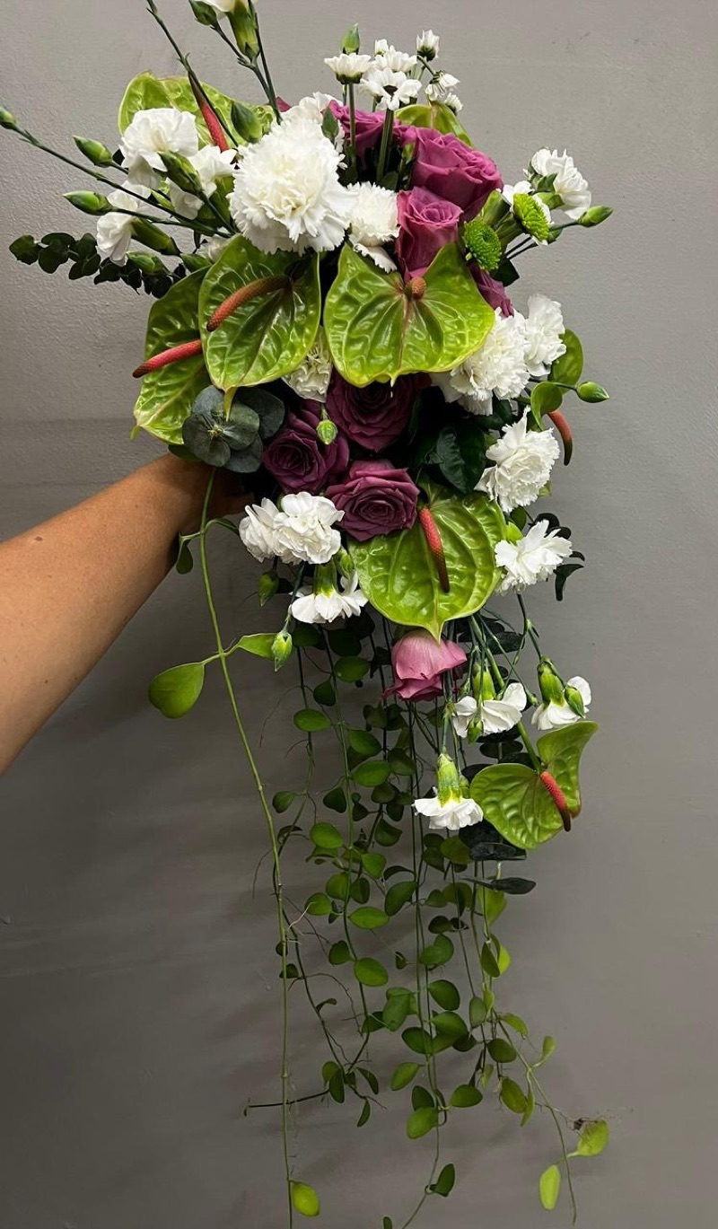 Green anthurium and mauve rose cascading bridal bouquet